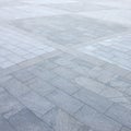 Fragment of the square paved of a large granite tiles Royalty Free Stock Photo