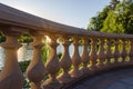 Fragment of stone balustrade over the decorative pond at sunset Royalty Free Stock Photo