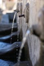 A fragment of a stone bas-relief in the form of a person`s head Royalty Free Stock Photo