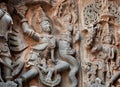 Fragment of stone carved relief with Garuda fighting a myth snake. 12th century South Indian temple. Halebidu, India