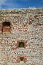 Fragment of a stone defensive wall of a medieval castle in Olsztyn Royalty Free Stock Photo