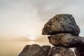 Fragment of stone megalith at sunset