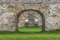 Fragment of stone old ruins overgrown with grass Royalty Free Stock Photo