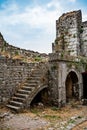 Fragment of a stone wall with arched holes and a staircase in Shkoder Castle Albania. Ruins of a medieval European defensive Royalty Free Stock Photo