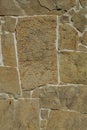 Fragment of the stone wall with a flat brown pattern Royalty Free Stock Photo