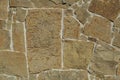 Fragment of the stone wall witha flat brown pattern Royalty Free Stock Photo