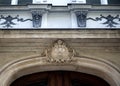 Fragment of stucco decoration of facade of ancient building. Royalty Free Stock Photo