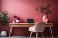 Fragment of stylish minimalist monochrome interior of modern office room in pastel carmine red and pink tones. Large desktop,