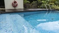 A fragment of a swimming pool. The blue tiled bottom is visible Royalty Free Stock Photo