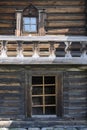 Fragment of a 19th century wooden house with a balcony and windows on Kizhi Island in Karelia