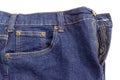 Fragment of the new dark blue jeans on white background Royalty Free Stock Photo