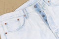 Fragment of the top of the white artificially aged jeans Royalty Free Stock Photo