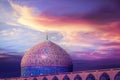 Fragment of traditional Iranian architecture against beatiful purple sky and yellow and pink clouds. Beautiful sunset.