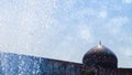 Fragment of traditional Iranian architecture against the blue sky and drops of water. The dome of the traditional national mosque. Royalty Free Stock Photo