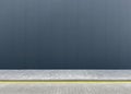 a fragment of an urban concrete wall of a building and an asphalt sidewalk Royalty Free Stock Photo