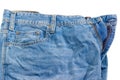 Fragment of the used crumpled blue jeans on white background Royalty Free Stock Photo