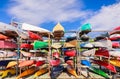 fragment of view of stylish sport canoe colorful boats background at waterfront marine center