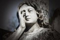 Fragment of vintage statue of a sad ange details