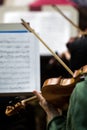 Fragment of a violin in the hands of a musician Royalty Free Stock Photo