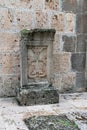 Armenia, Haghartsin, September 2021. Khachkar with Christian symbols at the wall of the church.