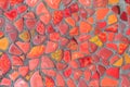 The fragment of the wall is decorated in red mosaic of different shades as a background or a backdrop Royalty Free Stock Photo