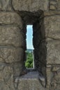 Embrasure in the wall of fortress Royalty Free Stock Photo