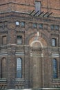 Fragment of a wall of an old red brick building. Water tower. Royalty Free Stock Photo