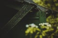 A fragment of the wall of an old ruined dilapidated wooden house