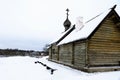 Old Russian log church and view of the Volkhov River in winter. Royalty Free Stock Photo