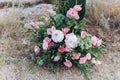 Fragment of a wedding arch for an exit ceremony decorated with white and pink flowers.