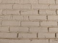 a fragment of a white wall, made of neat thin and elongated antique bricks Royalty Free Stock Photo