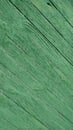 Fragment of wood painted green. Background texture close-up. Diagonal. Close-up
