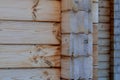 Fragment of a wooden house made of deciduous timber