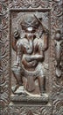 Fragment of wooden nepalese door with Ganesha