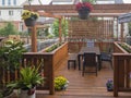 Fragment of a wooden veranda with flowers in pots Royalty Free Stock Photo