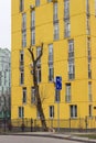 Fragment of yellow facade of multi story apartment building