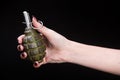 fragmentation grenade in girl hand