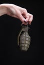 fragmentation grenade in woman hand