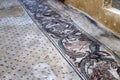 Fragments of ancient religious mosaics on the ruins of a church in the middle of the 6th century AD in northern Israel