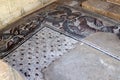 Fragments of ancient religious mosaics on the ruins of a church in the middle of the 6th century AD in northern Israel