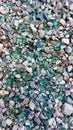 Fragments of colored broken glass with gravel Royalty Free Stock Photo