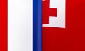 Fragments of the national flags of France and the Kingdom of Tonga