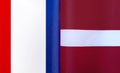 Fragments of the national flags of France and Latvia