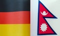 fragments of the national flags of Germany and Nepal