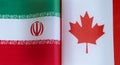 Fragments of national flags of Iran and Canada close-up