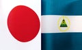 Fragments of the national flags of Japan and the Republic of Nicaragua