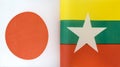 Fragments of the national flags of Japan and the Republic of the Union of Myanmar closeup