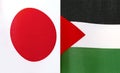 Fragments of the national flags of Japan and the State of Palestine