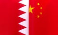 Fragments of national flags of the Kingdom of Bahrain and China