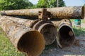 Fragments of old large water pipes. After many years of operation, corroded metal pipe destroyed. Rusty steel tube with holes meta Royalty Free Stock Photo